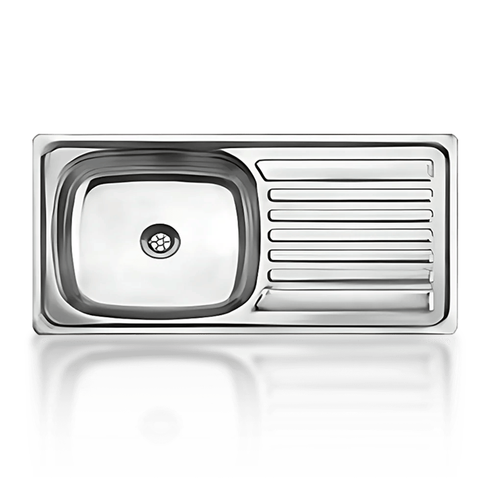 A stainless steel kitchen sink with a single basin on the left and a ribbed draining board on the right. The sink is reflected on a glossy surface. Its called Drop in Sink Single 910X460